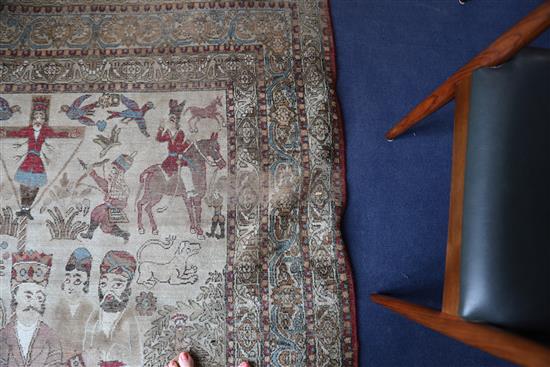 A 19th century Persian ivory ground pictorial rug, depicting a Shah, 6ft 9in by 4ft 7in.
